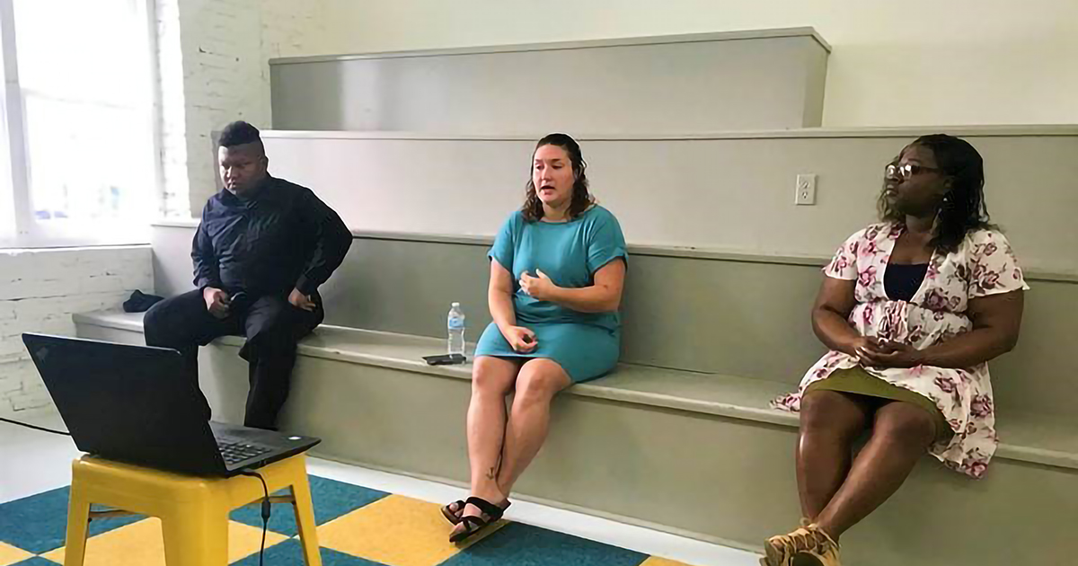 Three Mississippi Youth Voice members sit several feet apart while speaking on a video conference